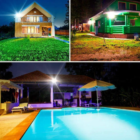 JUDYSSY Outdoor Solar Flood Lights with Remote Control illuminating a backyard pool and two homes at night.