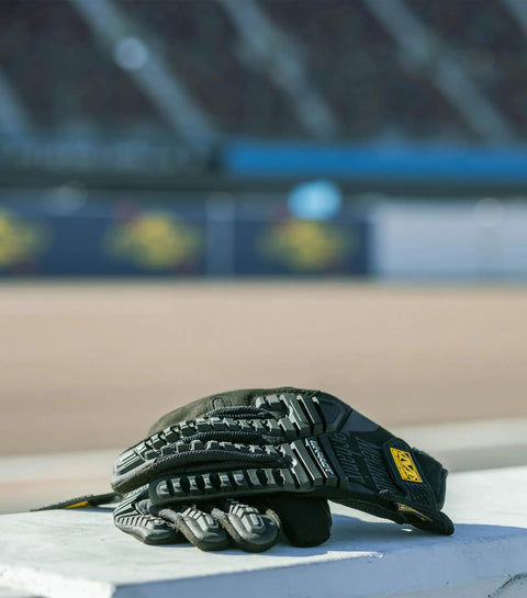 M Pact Impact Resistant Work Gloves With Two Millimeter D3O Palm Padding for Men Medium Black resting on ledge