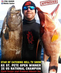 Man holding two large fish on a boat, wearing sunglasses and a hat, with text overlays about a spearfishing champion.