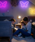 Three Piece Butterfly Neon Signs Set For Bedroom Decor displayed above beds, lit in pink, purple, and yellow, creating cozy ambiance.