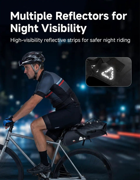 Cyclist using Expandable 13L-15L Waterproof Bikepacking Saddle Bag for Road, Mountain, and E-Bikes with Roll-Top Closure at night