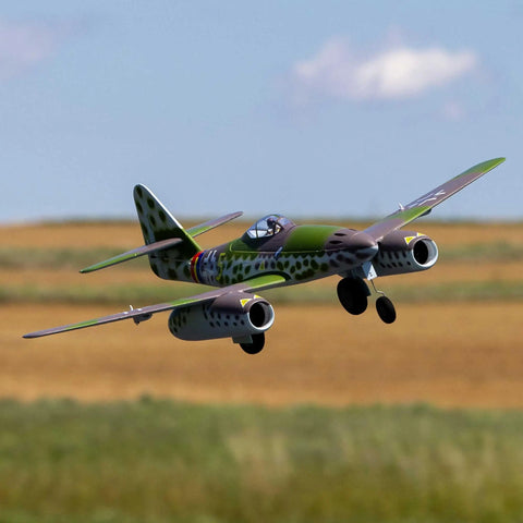 Me 262 EDF RC Warbird Airplane Bind N Fly Basic Jet Fighter Model flying over a grassy field, camo pattern visible, twin engines