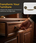 Hand pulling an antique brass drawer handle, part of the Antique Drawer Pulls 4 Pack for Dresser and Cabinet, shown on a wooden dresser.