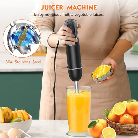 Slick Hands Down Game Changer 800 Watt Immersion Hand Blender With 12 Speeds And Turbo Boost Titanium Reinforced Blade Bpa Free 4 In 1 Kitchen Combo Featuring Chopper And Egg Beater Tool in use blending orange juice.