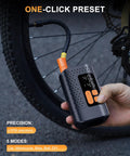 Person using 4X Faster Dope Bike Floor Pump With Gauge And Auto Stop 160 PSI Compact Mini Pump to inflate bike tire