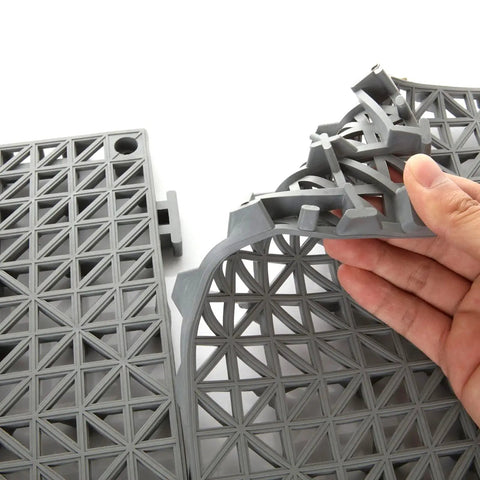 Close-up of Interlocking Cushion PVC Flooring Tiles Set 12x12 Inches No Slip Drainage Mats being assembled, showing interlocking edges.