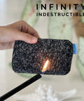 Infinity Sponge being tested for heat resistance with blue flame, showcasing the durable anti-cut design and silver fiber material.