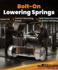 Mechanics working on bolt-on lowering springs for 3 Inch Front And 4 Inch Rear Drop Kit for 2000-2006 GM Tahoe Suburban Avalanche Yukon XL Escalade