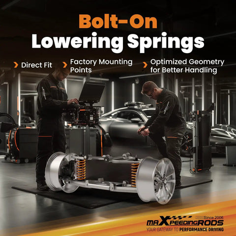 Mechanics working on bolt-on lowering springs for 3 Inch Front And 4 Inch Rear Drop Kit for 2000-2006 GM Tahoe Suburban Avalanche Yukon XL Escalade