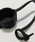 Keep Your Rig Running Smooth With This Hella Reliable EV Charger Plug Port Cover featuring a black rubber J1772 dust cap with a zip tie mount.