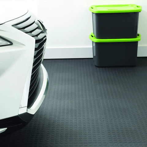 Car parked on Interlocking 18x18 Inch Rubber Floor Tiles For Home Gym Garage Basement And Trade Show Flooring, raised coin pattern
