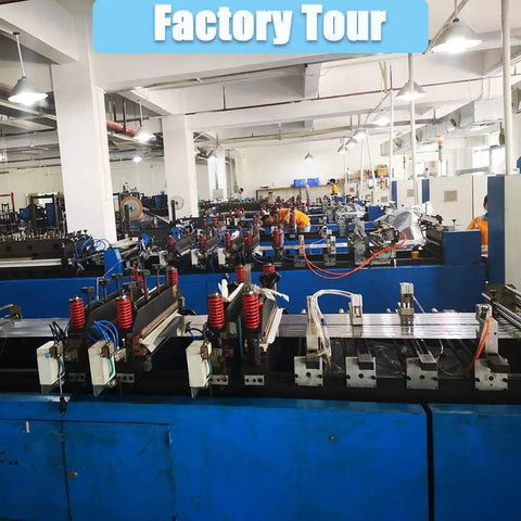 Interior view of factory with machinery during a tour, showcasing production process and equipment.
