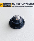 Front view of black self-adhesive caster wheel with stainless steel ball bearing and mounting holes