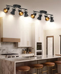 Plug In Four Light Track Lighting Fixture In Industrial Black With Long 14.7 Foot Wire in a modern kitchen setting