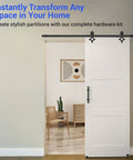 Heavy Duty Barn Door Hardware Kit With Handle for Smooth Sliding Doors installation in a home with a black finish track and rails.