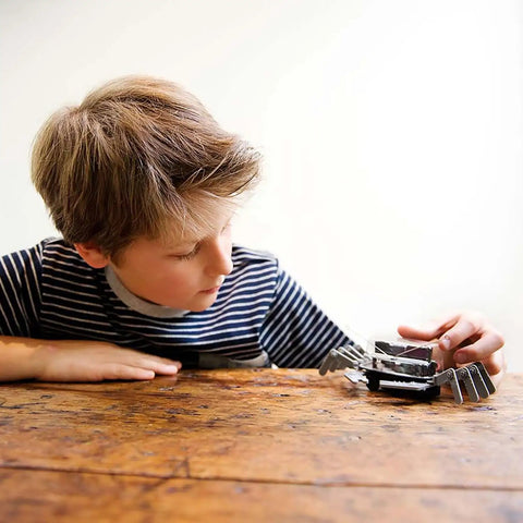 Tabletop Robot Kit For Kids And Teens, DIY Robotics STEM Toy That Builds An Awesome Mechanical Crab, Easy Assembly, Edge Detector Engineering Gift For Boys And Girls, Educational Hands On Fun, boy assembling metal crab on table