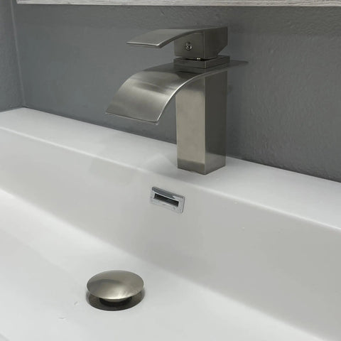 Remi Single Lever Lav Faucet In Oil Rubbed Bronze Finish with High-Pressure Ceramic Cartridge, Solid Brass Build, installed on sink