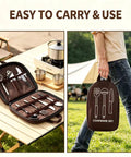 Waterproof Camp Kitchen Knife Bag With Large Capacity Storage And Hooks For Camping shown filled with utensils, carried outdoors.