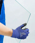 Person handling glass with Level 5 Cut Resistant Work Gloves With Nitrile Palm Grip For Dry To Oily Surfaces, 3D Comfort Stretch Fit.