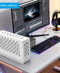 External GPU Dock For Laptops Featuring Heavy Duty Metal Frame And Real PCIe 4.0 Support on a video editing desk setup.