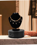 Levemolo Electric Rotating Turntable Display Stand For Jewelry And Watches with necklace on black velvet bust