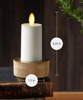 Outdoor Flameless LED Votive Candle Set of 2, Ivory 1.5 x 4 Inches, placed on tabletop, moving flame visible, warm ambiance.