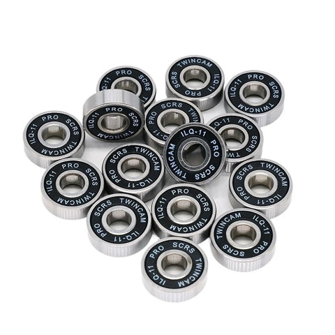Eight Pack ILQ-11 Bearings 8x22x7mm for longboard inline skate wheel replacement, multiple black and silver bearings clustered