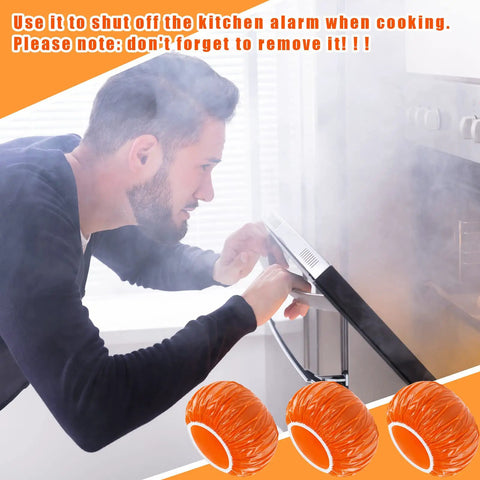 Orange 24 Piece Elastic Smoke Detector Covers For Cooking Or Baking Thickened Plastic Fire Alarm Shield in use during cooking