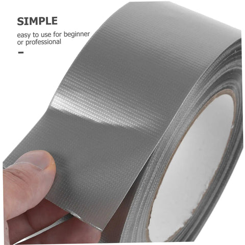 Close-up of a silver roll of Heavy Duty Duct Tape Sealing Tape for Indoor and Outdoor Use Quick Fix Pipe Leaks and Repairs Base Waterproof Cloth Tape You Can Tear by Hand Sticks Fast and Holds Tough for Household Garage and Outdoor Projects, showing tear-by-hand feature.