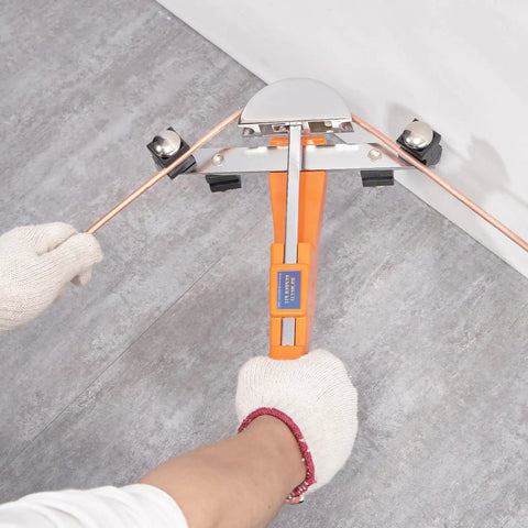 User bending copper tube with Vevor 1-4 To 7-8 Inch O.D. Ratcheting Pipe Tube Bender for HVAC projects.