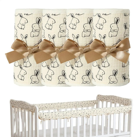 Breathable Cotton Gauze Bed Rail Teething Protector For Baby Crib Sides with bunny print and tan ribbon bows for secure fit.