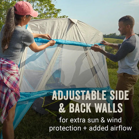 Two people setting up Portable 7x7ft Backpack Sun Shelter with Lightweight Shade Canopy, adjustable side and back walls, outdoors.