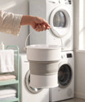 Compact Folding Mini Washing Machine Portable Laundry Basin Road Trip Ready Dorm Staple Gentle Cycle For Underwear And Socks, held in hand.
