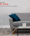 Living room with sofa, Long 15 Foot Heavy Duty Surge Protector Power Strip With Six Outlets Flat Plug 800 Joules connected.