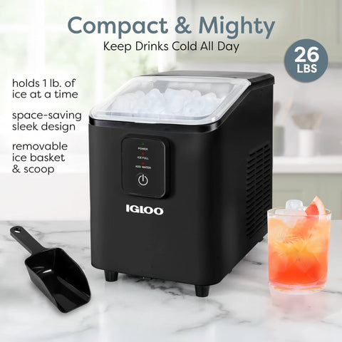 Igloo countertop ice maker, black compact unit with transparent lid and ice inside; includes scoop and basket
