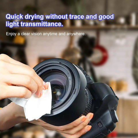 Lens wipes for eyeglasses and camera lenses; close-up of hand wiping a lens with a white cloth.