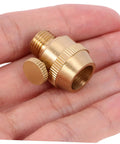 Solid Brass Cord Grip For Edison Style Pendant Lights on a hand, showcasing threaded cable locker and rugged metal design