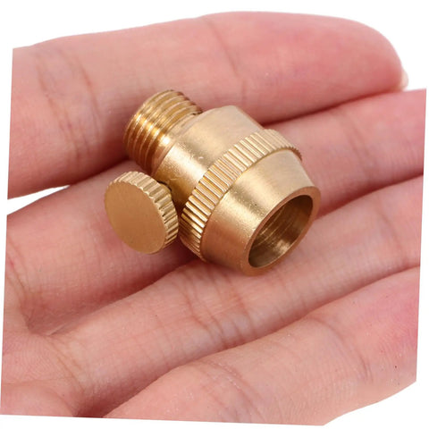 Solid Brass Cord Grip For Edison Style Pendant Lights on a hand, showcasing threaded cable locker and rugged metal design