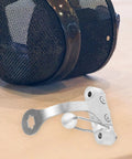 Replacement Epee Socket Bracket For Fencing Training And Repair on wooden surface, durable stainless steel gear visible