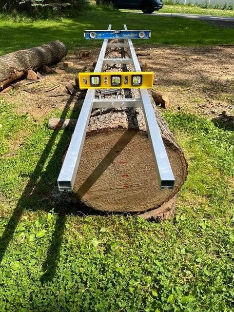 Rail Mill Guide System 9 Ft With 3 Crossbar Kits on log, showing smooth sliding and straight, level first cuts on large log.