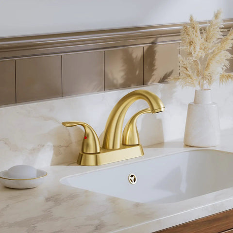 Brushed Gold 4 Inch Centerset Bathroom Faucet With Two Handles, Fits 2 Or 3 Hole Mount, Includes Copper Pop Up Drain And Water Supply Lines, Sturdy Brass Construction, BF008-5-BG installed on a marble countertop with a decorative vase.