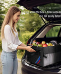 Trunk Organizer For Cars And SUVs Portable And Collapsible Waterproof Oxford Cloth with Aluminum Handle, ideal for camping and storage, shown in car trunk with groceries.
