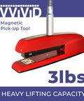 Magnetic Grabber Tool With 3 Lbs Lifting Capacity And 23 Inch Flexible Steel Shaft lifting a red stapler