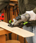 User operating 20V Cordless Mini Circular Saw With Laser Guide And Dual Blades Compact Wood Cutter on a wood plank.