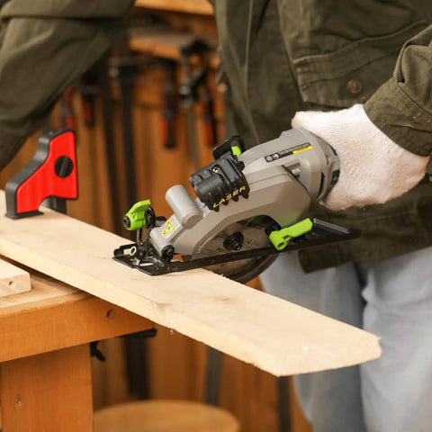 User operating 20V Cordless Mini Circular Saw With Laser Guide And Dual Blades Compact Wood Cutter on a wood plank.