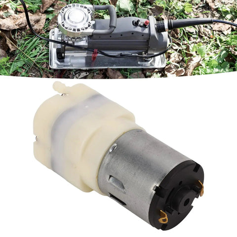 Top Shelf Dc Micro Air Pump And Mini Vacuum Module Rated From 3.7 To 24 Volts running on grass, showcasing a smooth, durable design.