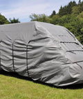Gray tarp secured with Adjustable 31 Inch Rubber Bungee Cords With Hooks EPDM Heavy Duty Bungee Straps on a van