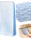 8 Pack Clear Furniture Leveler Shims Non Slip Rubber Table Wedges For Uneven Floors showing individual wedge against wood floor.