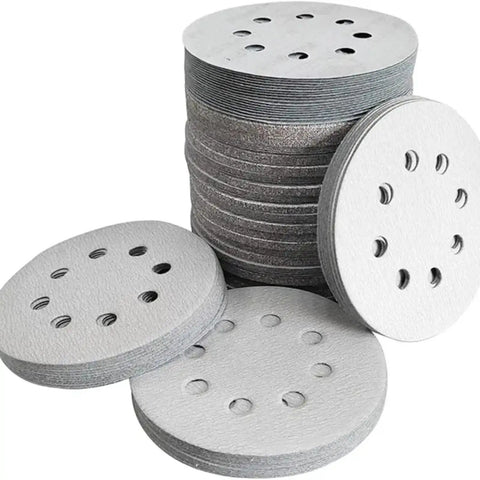 Premium 5 Inch Sanding Discs With 8 Holes For Dust Free Grinding, stacked and laid out for wet or dry use.
