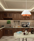 Adjustable One Light Hanging Pendant Light with Matte White Metal Dome Shade above kitchen counter, indoor setting